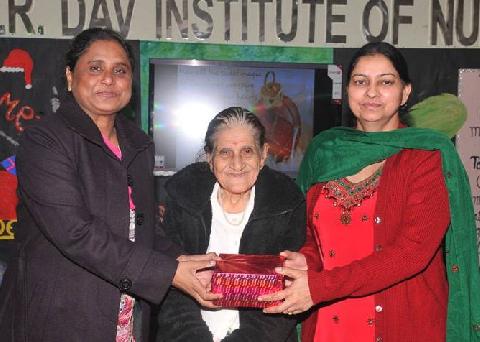 X-Mas Gift gifted by Honorable Chief Guest Mrs. Zeenat Williams and Respected Principal Madam Mrs. Veena Williams to 
Vice Principal Madam Dr.(Mrs.) Harbans Kaur